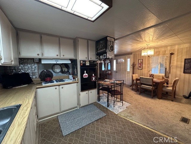 701 Montara Road, Unit 53 Barstow, CA 92311 - Photo 11 of 21 a kitchen with a sink and cabinets