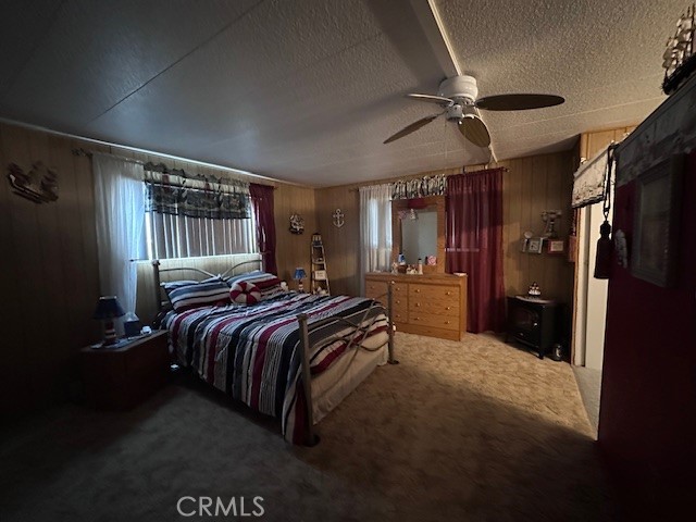 701 Montara Road, Unit 53 Barstow, CA 92311 - Photo 16 of 21 a bedroom with a bed closet and a large mirror