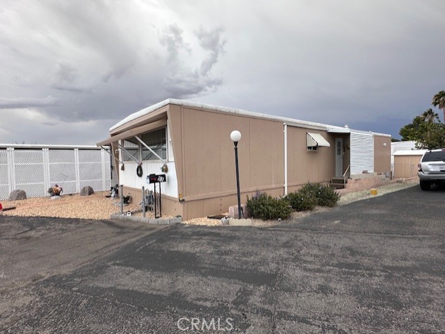 701 Montara Road, Unit 53 Barstow, CA 92311 - Photo 3 of 21 a view of a house with a patio