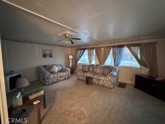 701 Montara Road, Unit 53 Barstow, CA 92311 - Photo 5 of 21 a bedroom with furniture and a window