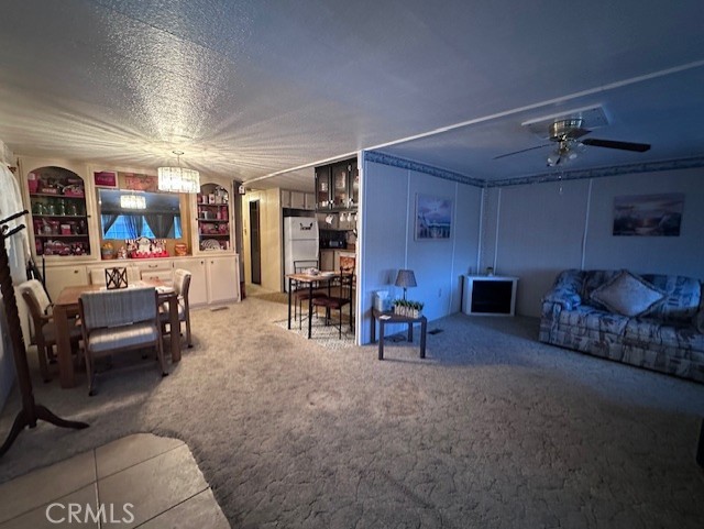 701 Montara Road, Unit 53 Barstow, CA 92311 - Photo 8 of 21 a living room with furniture and wooden floors