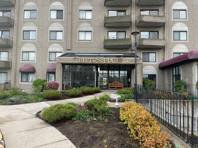 a view of a brick building with many windows
