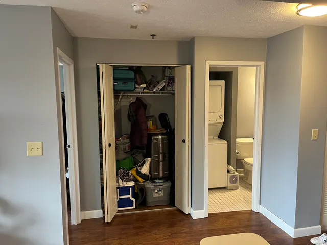 a view of a hallway with bathroom and closet