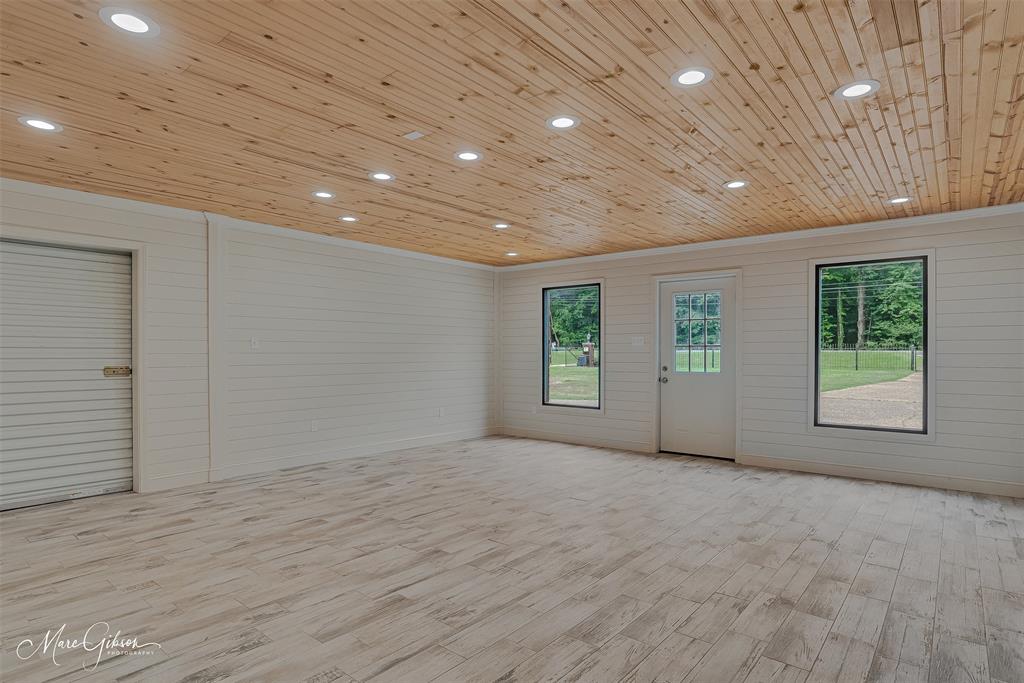5800 Jefferson Paige Road Shreveport, LA 71119 - Photo 37 of 40 50' x 80' conditioned shop with bathroom and additional covered equipment storage at rear