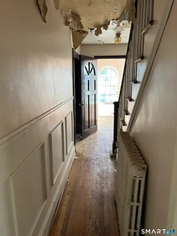 a view of wooden floor and small living room