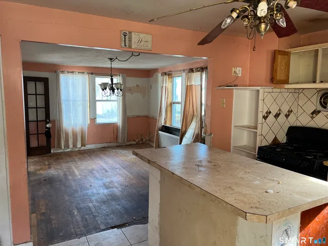 a view of a kitchen with a sink and cabinets