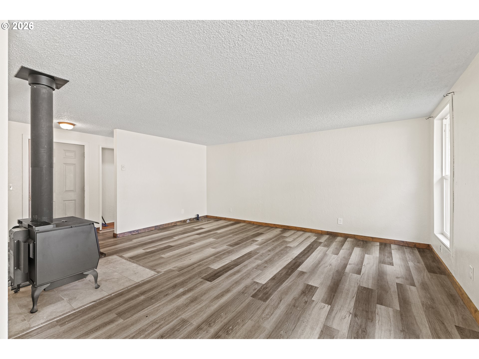 1816 Sunset Court Myrtle Point, OR 97458 - Photo 21 of 42 a view of an empty room and wooden floor