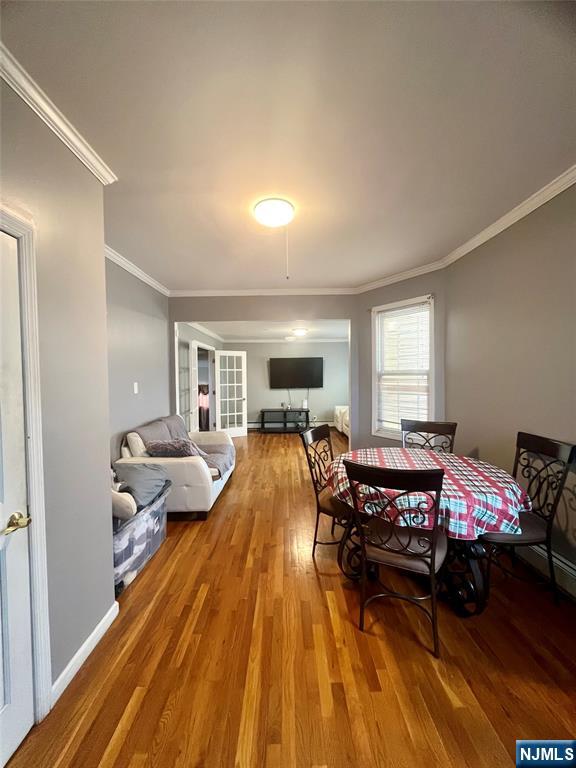 315 Coit Street Irvington, NJ 07111 - Photo 4 of 12 a living room with furniture and a wooden floor
