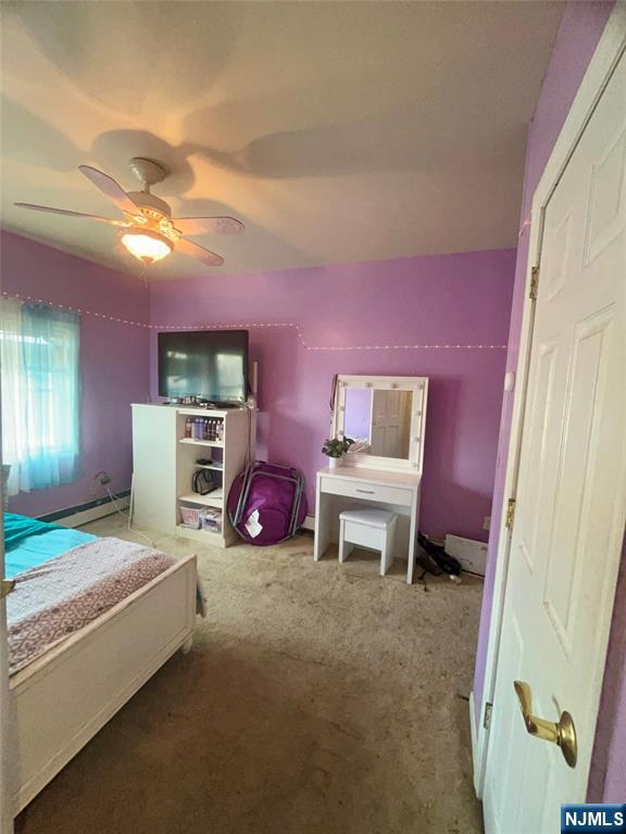315 Coit Street Irvington, NJ 07111 - Photo 9 of 12 a bedroom with furniture and a bed