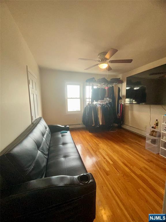 315 Coit Street Irvington, NJ 07111 - Photo 10 of 12 a living room with furniture and a wooden floor