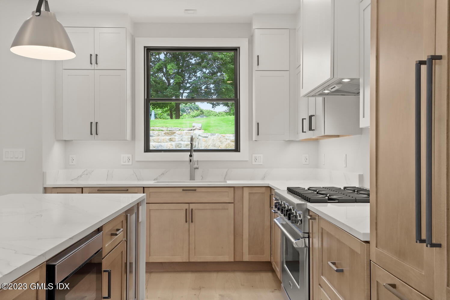 35 Bonwit Road Riverside, CT 06878 - Photo 4 of 20 a kitchen with stainless steel appliances granite countertop a sink stove and cabinets