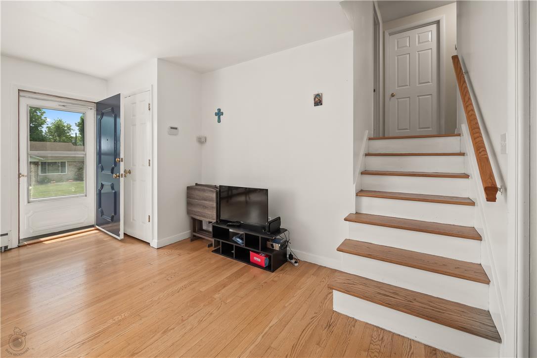 2439 Congress Street Allentown, PA 18104 - Photo 3 of 34 a view of room with wooden floor and windows