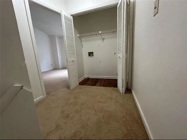 a large kitchen with cabinets and stainless steel appliances