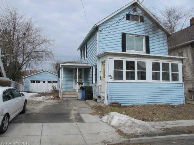 42 North Spring Street Meriden, CT 06451 - Photo 1 of 1 a front view of a house with a yard and garage