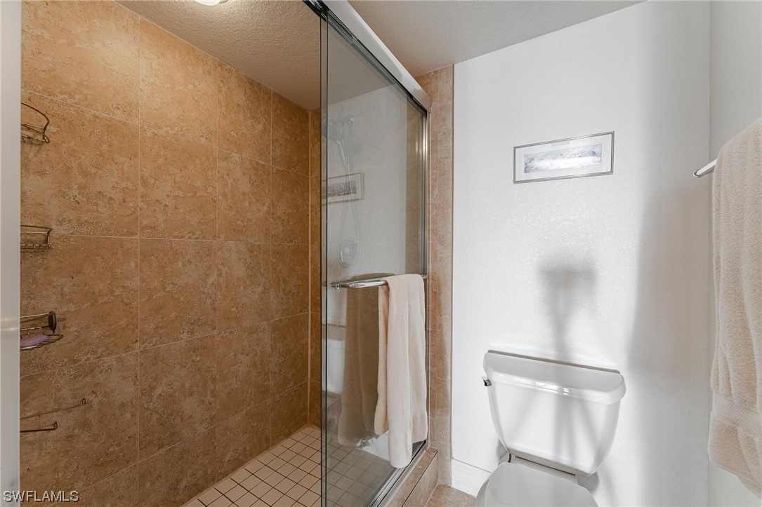 16641 Stringfellow Road, Unit 502 Bokeelia, FL 33922 - Photo 17 of 40 a bathroom with a shower