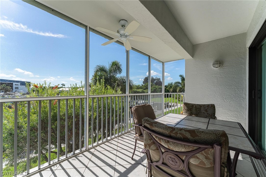 16641 Stringfellow Road, Unit 502 Bokeelia, FL 33922 - Photo 21 of 40 a balcony view with a seating space