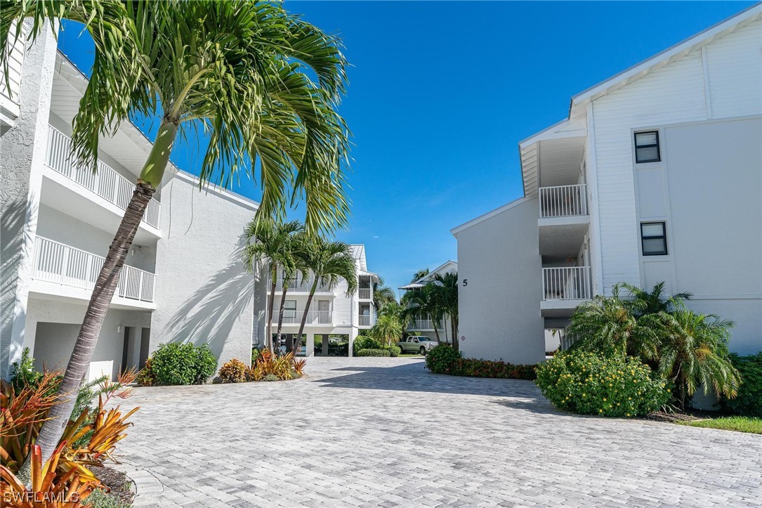 16641 Stringfellow Road, Unit 502 Bokeelia, FL 33922 - Photo 27 of 40 a front view of multiple houses with yard