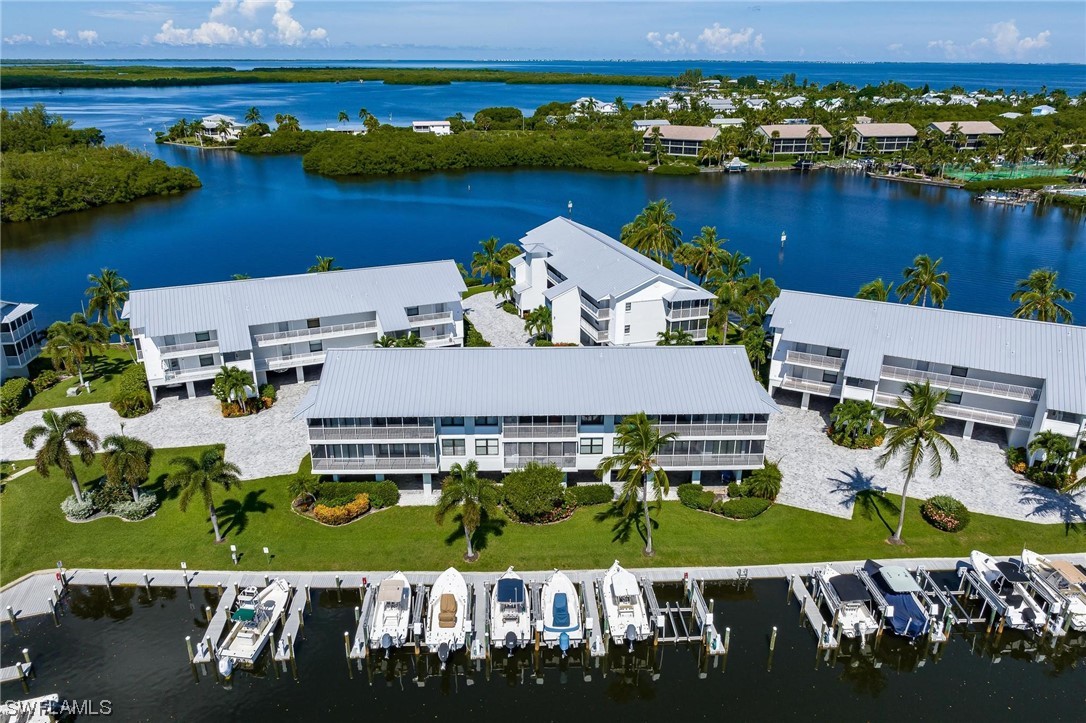 16641 Stringfellow Road, Unit 502 Bokeelia, FL 33922 - Photo 30 of 40 an aerial view of a house with a lake view