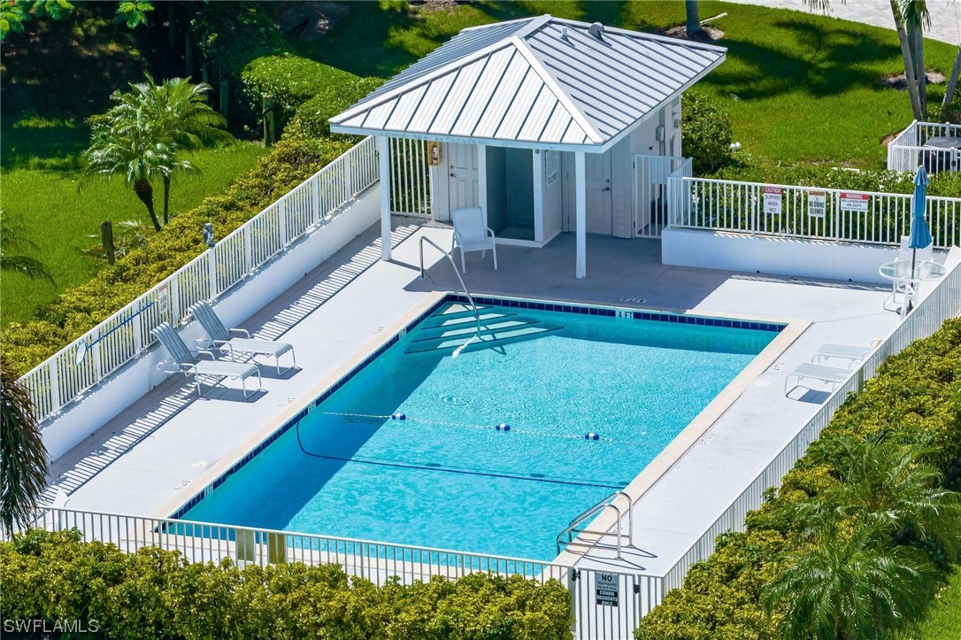 16641 Stringfellow Road, Unit 502 Bokeelia, FL 33922 - Photo 33 of 40 a view of a patio with chairs and a small yard