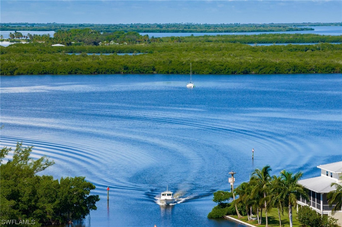 16641 Stringfellow Road, Unit 502 Bokeelia, FL 33922 - Photo 36 of 40 a view of a yard with an outdoor space