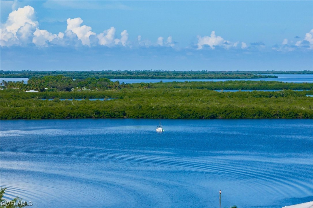 16641 Stringfellow Road, Unit 502 Bokeelia, FL 33922 - Photo 37 of 40 a view of a golf course with a lake