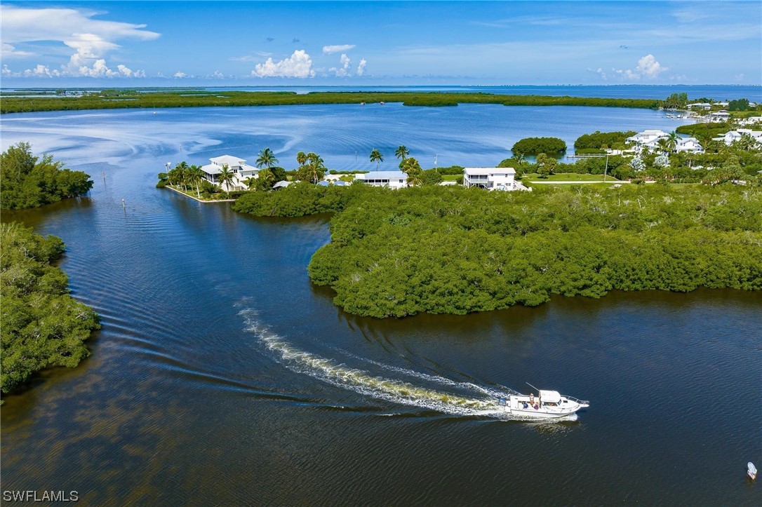 16641 Stringfellow Road, Unit 502 Bokeelia, FL 33922 - Photo 39 of 40 a view of a lake with outdoor space