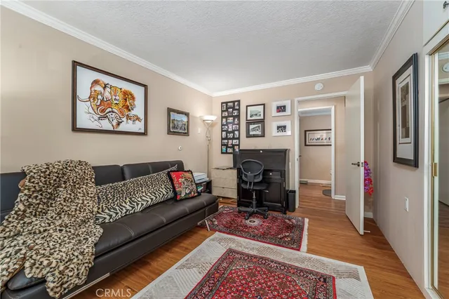 a living room with furniture a couch and a window