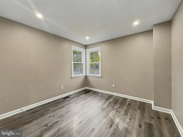 a view of room with window and hardwood floor
