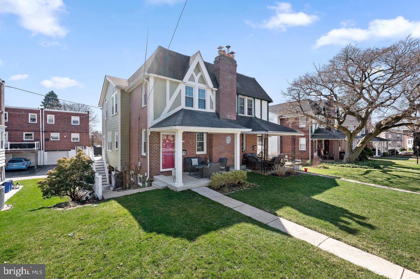 a front view of a house with a yard table and chairs