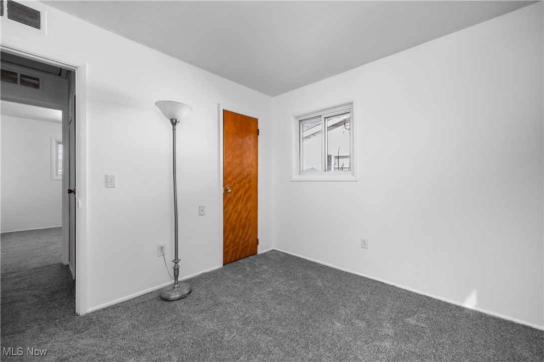 1065 Inland Street Vermilion, OH 44089 - Photo 23 of 50 Spare room featuring plenty of natural light and carpet