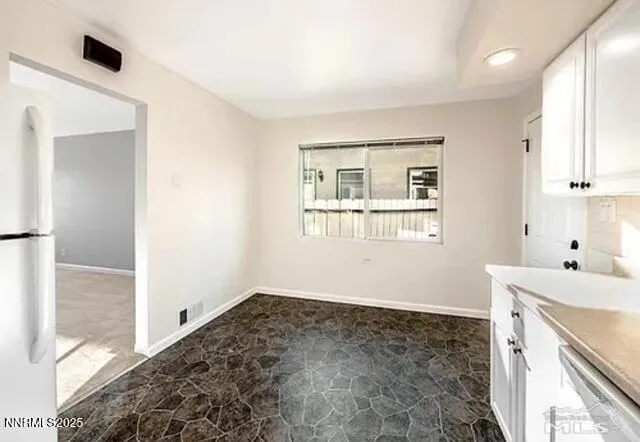 a room with a bed and a window