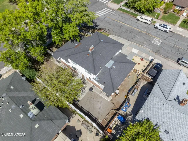 an aerial view of a house with a yard
