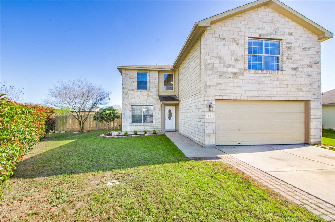 616 Lavaca Loop Elgin, TX 78621 - Photo 1 of 1 a front view of a house with a yard