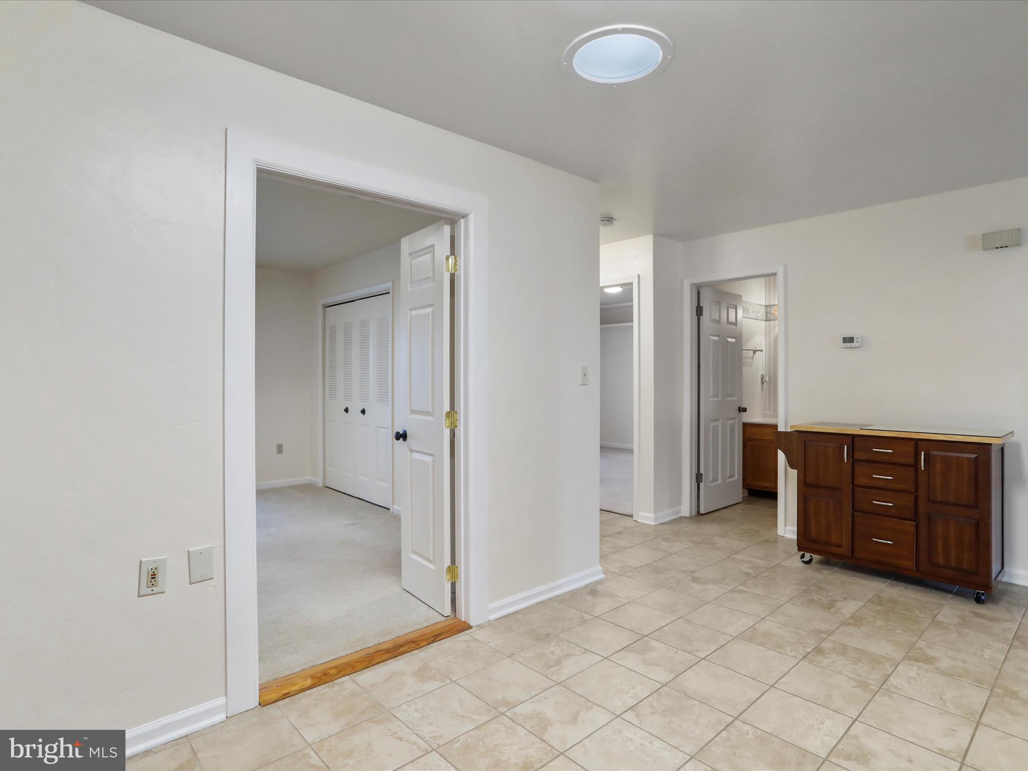 18016 Putter Drive Hagerstown, MD 21740 - Photo 11 of 26 an empty room with closet and wooden door