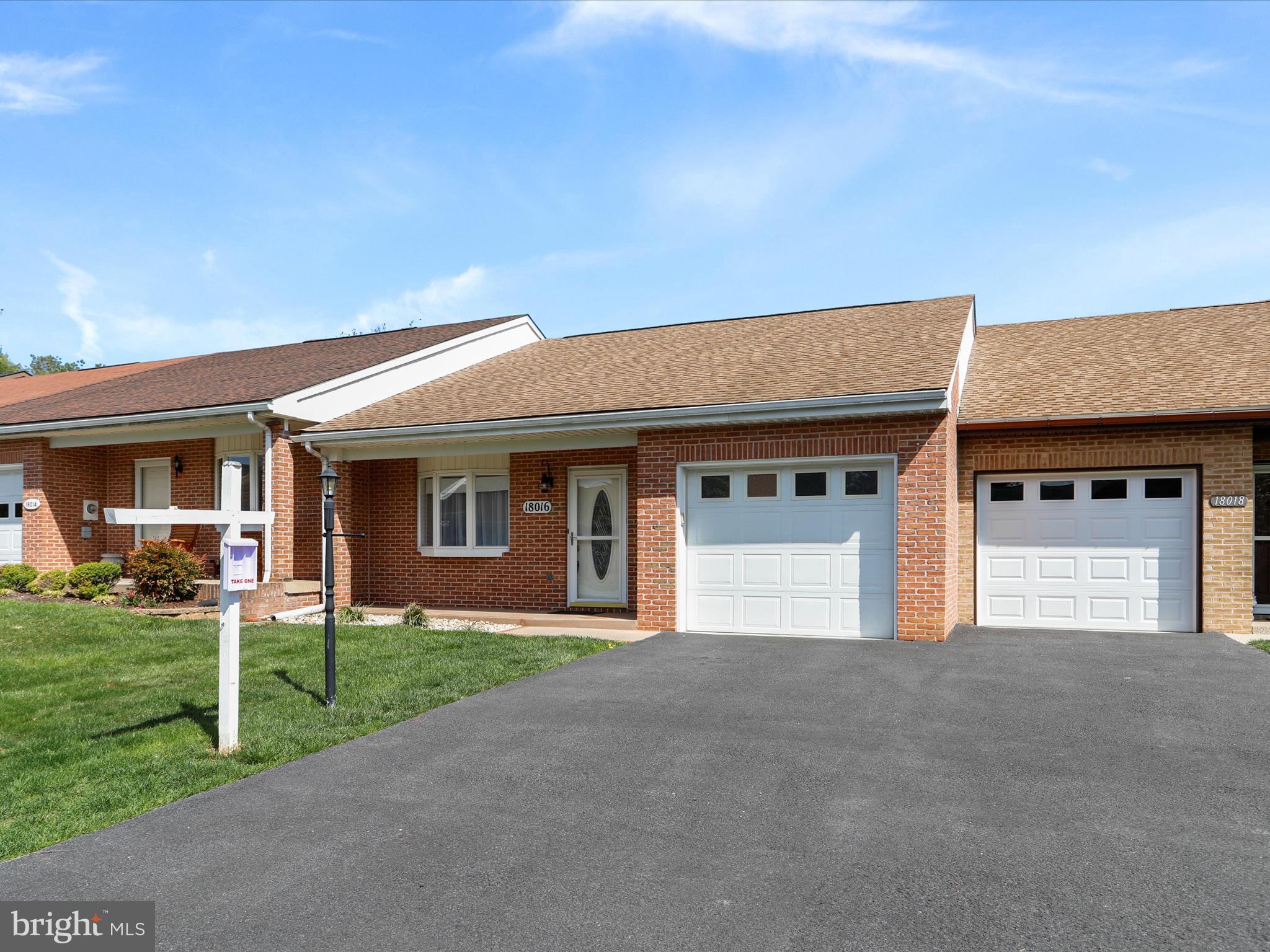 18016 Putter Drive Hagerstown, MD 21740 - Photo 3 of 26 a view of a house with a yard and garage