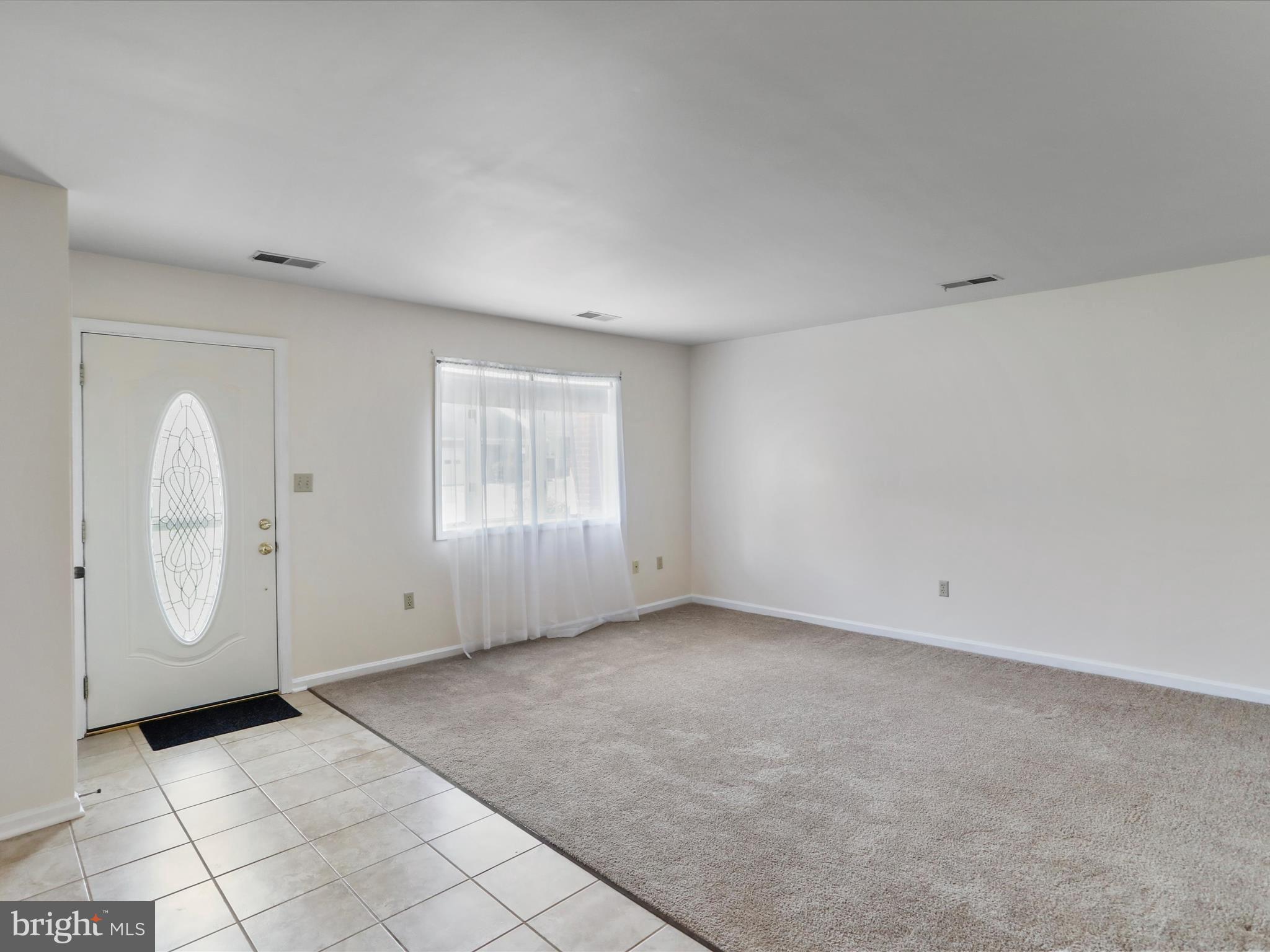 18016 Putter Drive Hagerstown, MD 21740 - Photo 6 of 26 an empty room with windows