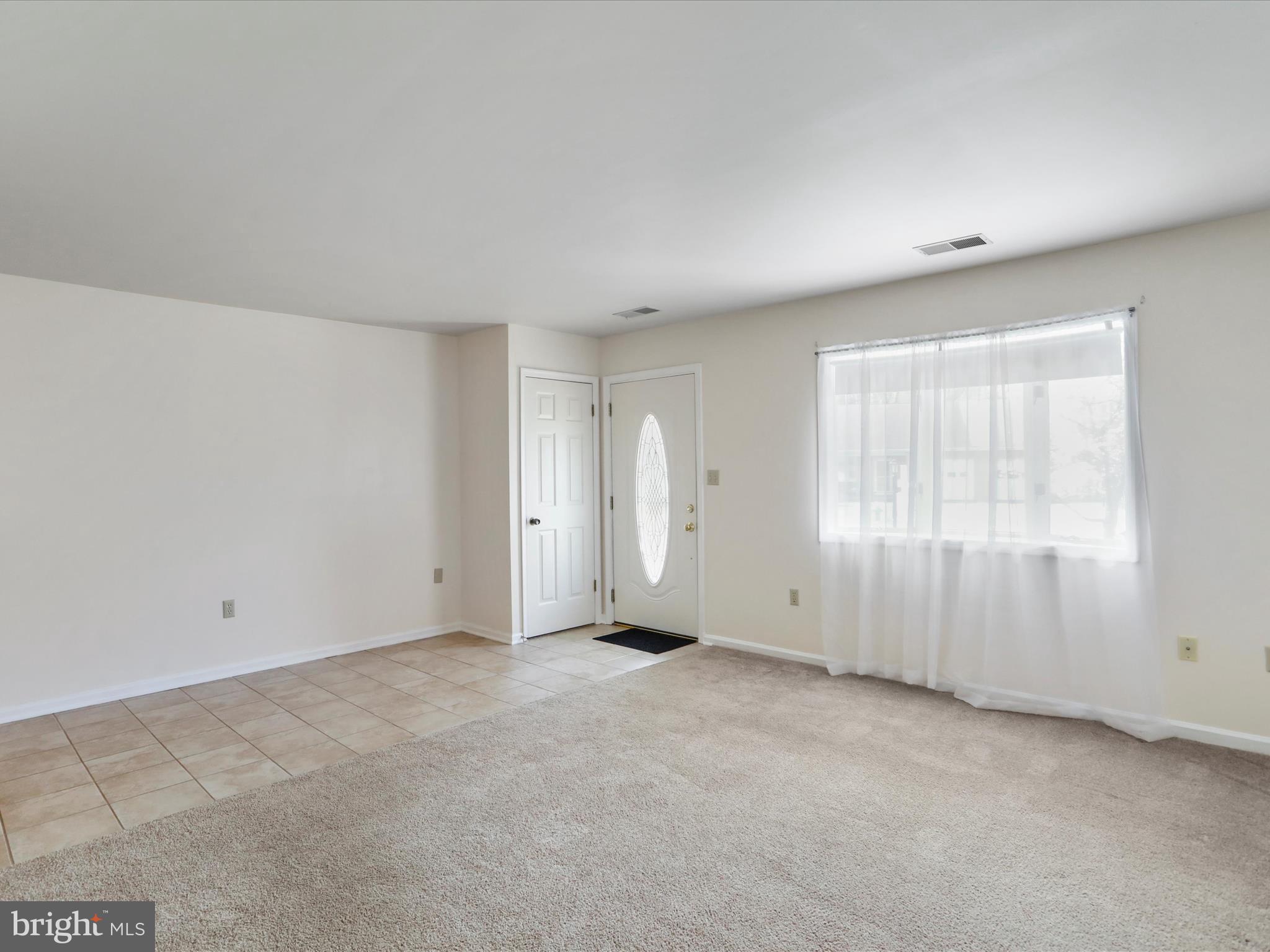 18016 Putter Drive Hagerstown, MD 21740 - Photo 7 of 26 an empty room with windows