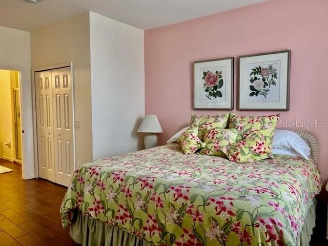 a bedroom with a bed and a dresser