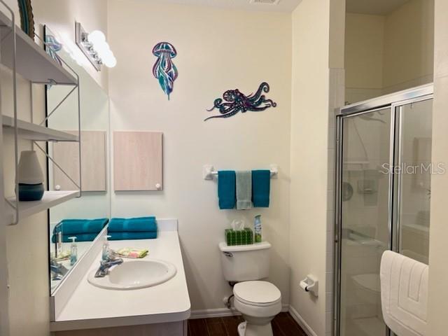 3181 Matecumbe Key Road, Unit 34 Punta Gorda, FL 33955 - Photo 17 of 54 a bathroom with a toilet sink and mirror