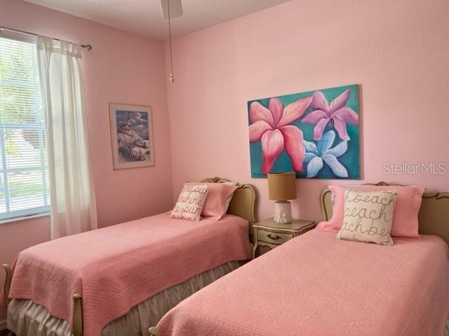 3181 Matecumbe Key Road, Unit 34 Punta Gorda, FL 33955 - Photo 19 of 54 a bedroom with two beds and a painting on the wall