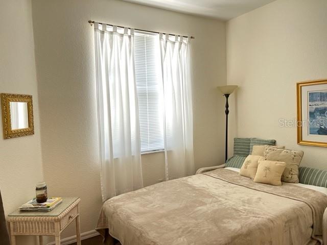 3181 Matecumbe Key Road, Unit 34 Punta Gorda, FL 33955 - Photo 21 of 54 a bedroom with a bed and a window