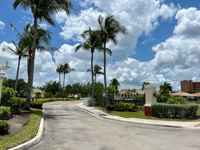 3181 Matecumbe Key Road, Unit 34 Punta Gorda, FL 33955 - Photo 26 of 54 a front view of multi story residential apartment building with yard and sign board