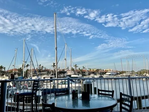 a view of a patio with a table and chairs