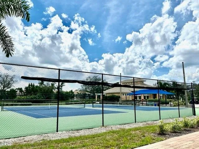 a view of an outdoor space and tennis court