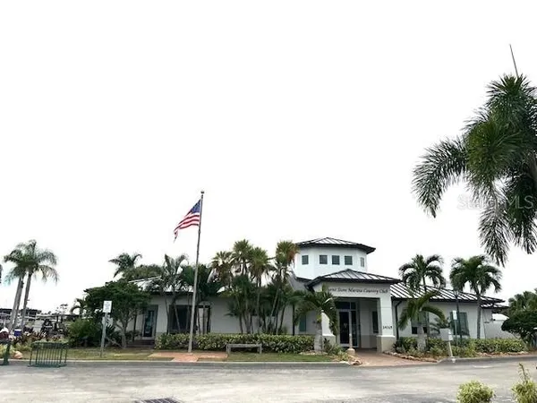 a view of a palm trees front of a house