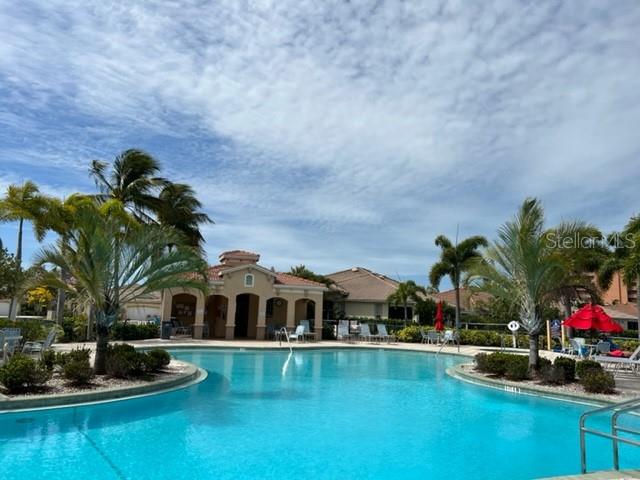 3181 Matecumbe Key Road, Unit 34 Punta Gorda, FL 33955 - Photo 7 of 54 a front view of house with yard and outdoor seating
