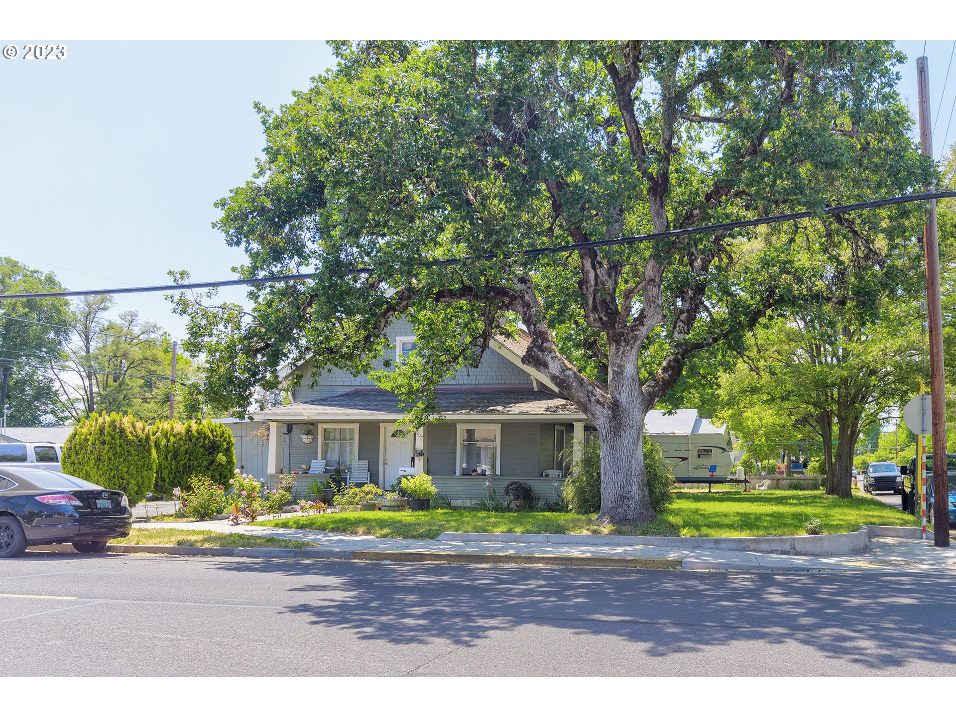 302 Southwest Pine Street Grants Pass, OR 97526 - Photo 1 of 20 a front view of a house with a garden