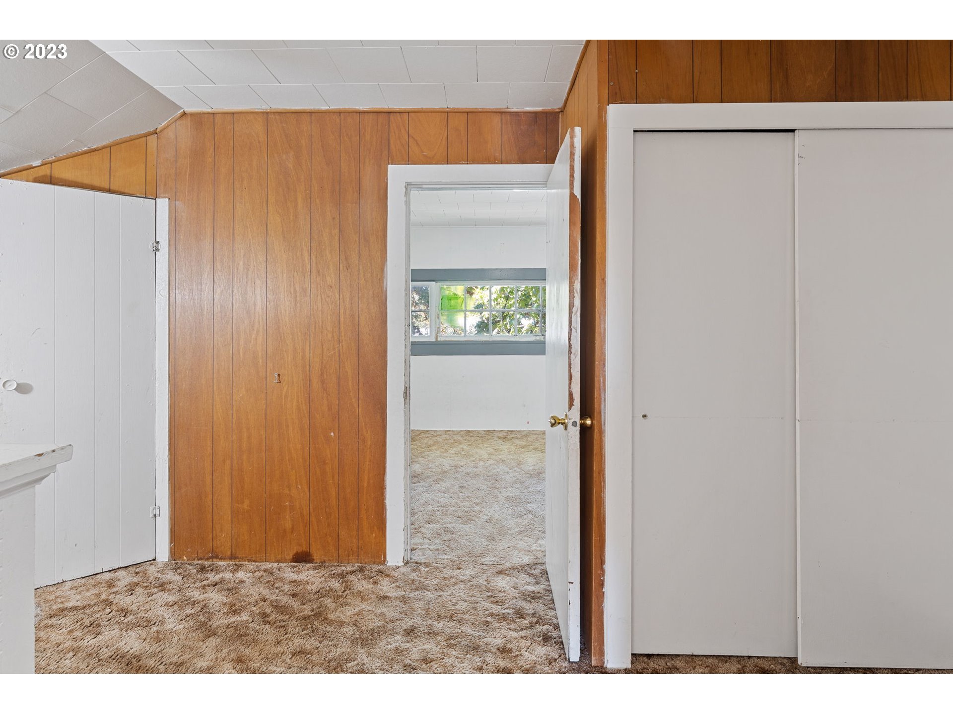 302 Southwest Pine Street Grants Pass, OR 97526 - Photo 16 of 20 a view of an empty room with closet and a window