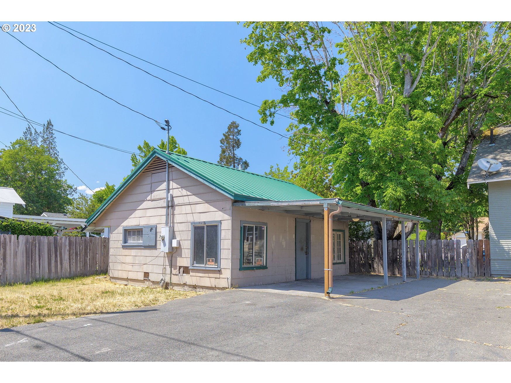 302 Southwest Pine Street Grants Pass, OR 97526 - Photo 20 of 20 a front view of a house with a garden and yard