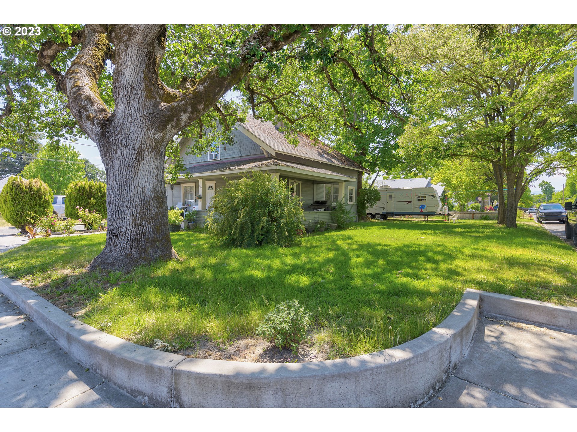 302 Southwest Pine Street Grants Pass, OR 97526 - Photo 2 of 20 a view of a house with a yard porch and sitting area